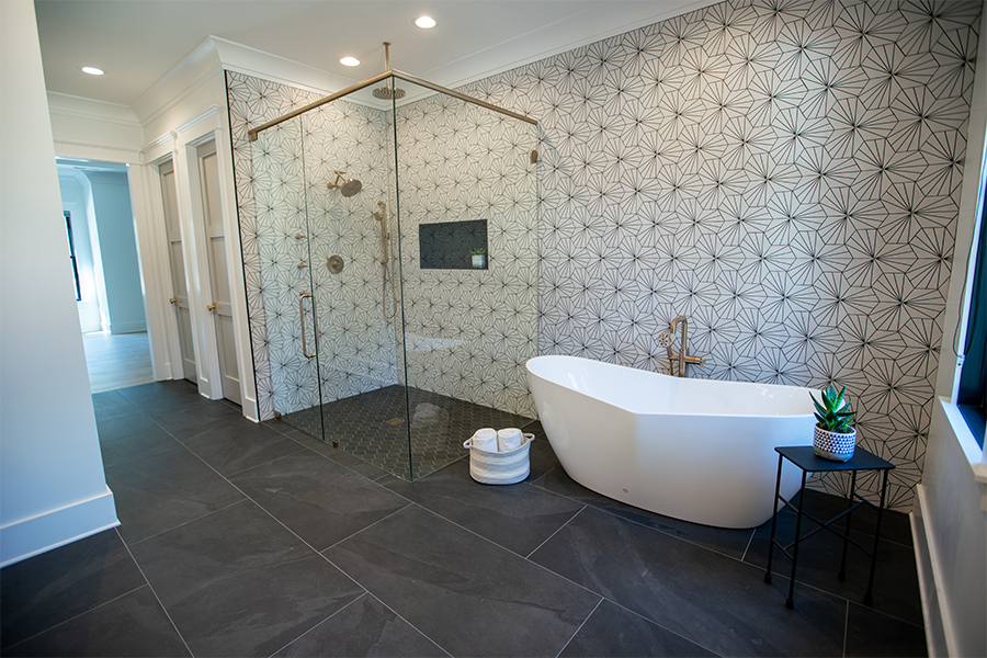 Brazilian Slate tile collection on the floor paired with the Striped Hex tile collection on the walls of a modern bathroom.