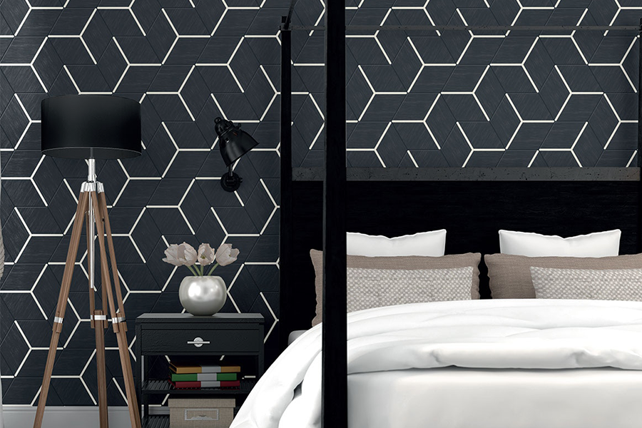 Black and white hexagonal tile pattern on a wall in a contemporary bedroom.