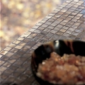 Food on a small brown tile countertop.
